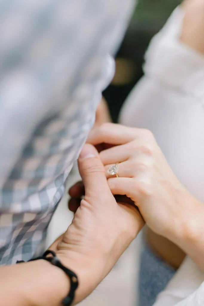 a couple holding hands after a proposal