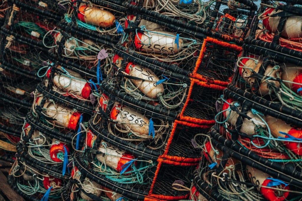 stacks of worn crab traps await fishing season