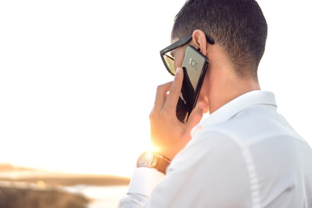 a man speaking with his charter company on the phone